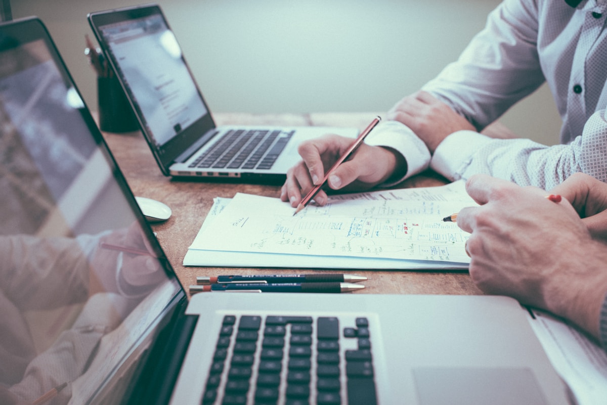 Counsel reviewing debt recovery strategy documents